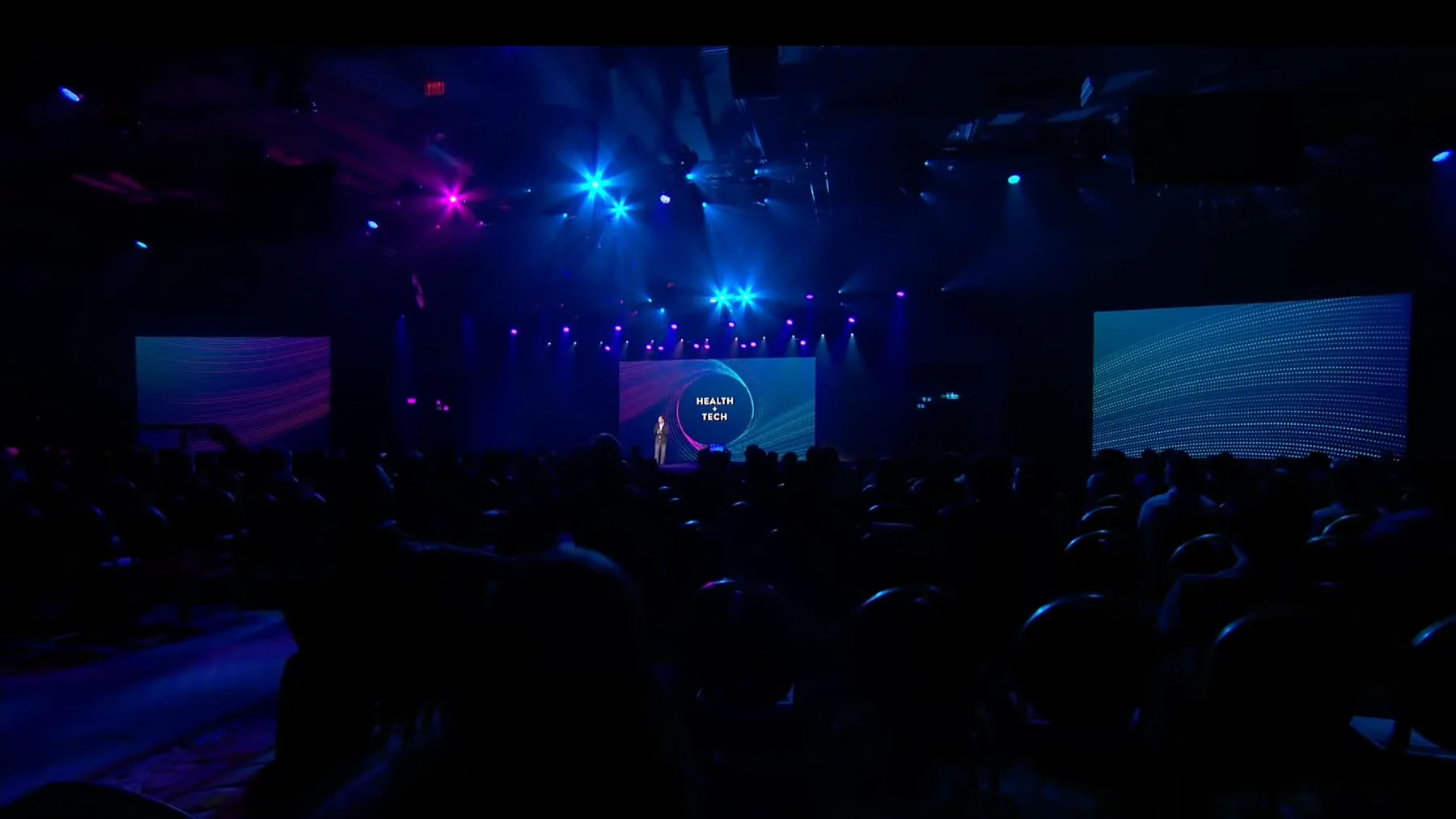 Abbott live CES keynote stage with audience and large screens